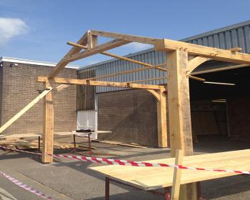 Oak Timber Carport  under construction at  Swansea Depot South Wales image